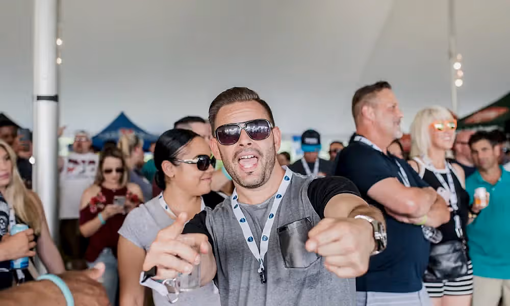 Man points at camera. 